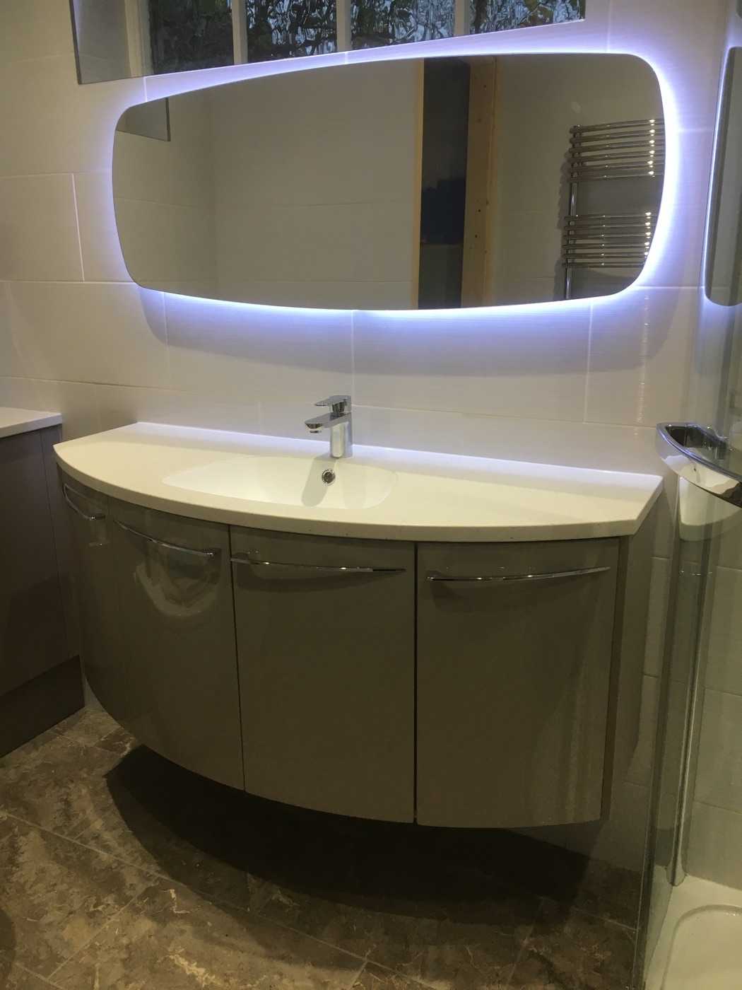 Modern bathroom with new plumbing fixtures installed by P.J. Services