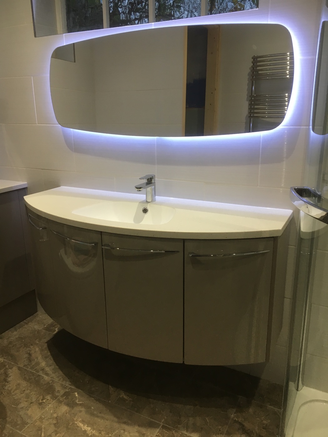 Modern bathroom with new plumbing fixtures installed by P.J. Services